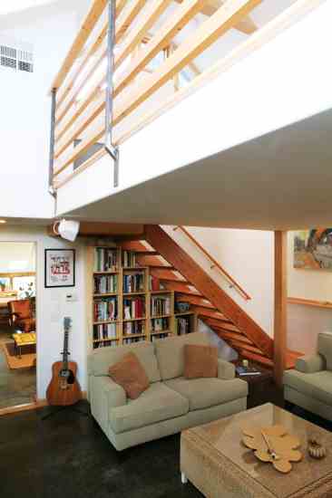 
The master bedroom floats above the back living room in the part of the house that made up a small addition a few years after the first remodel. This part of the house has in-floor radiant heat beneath concrete floors.
